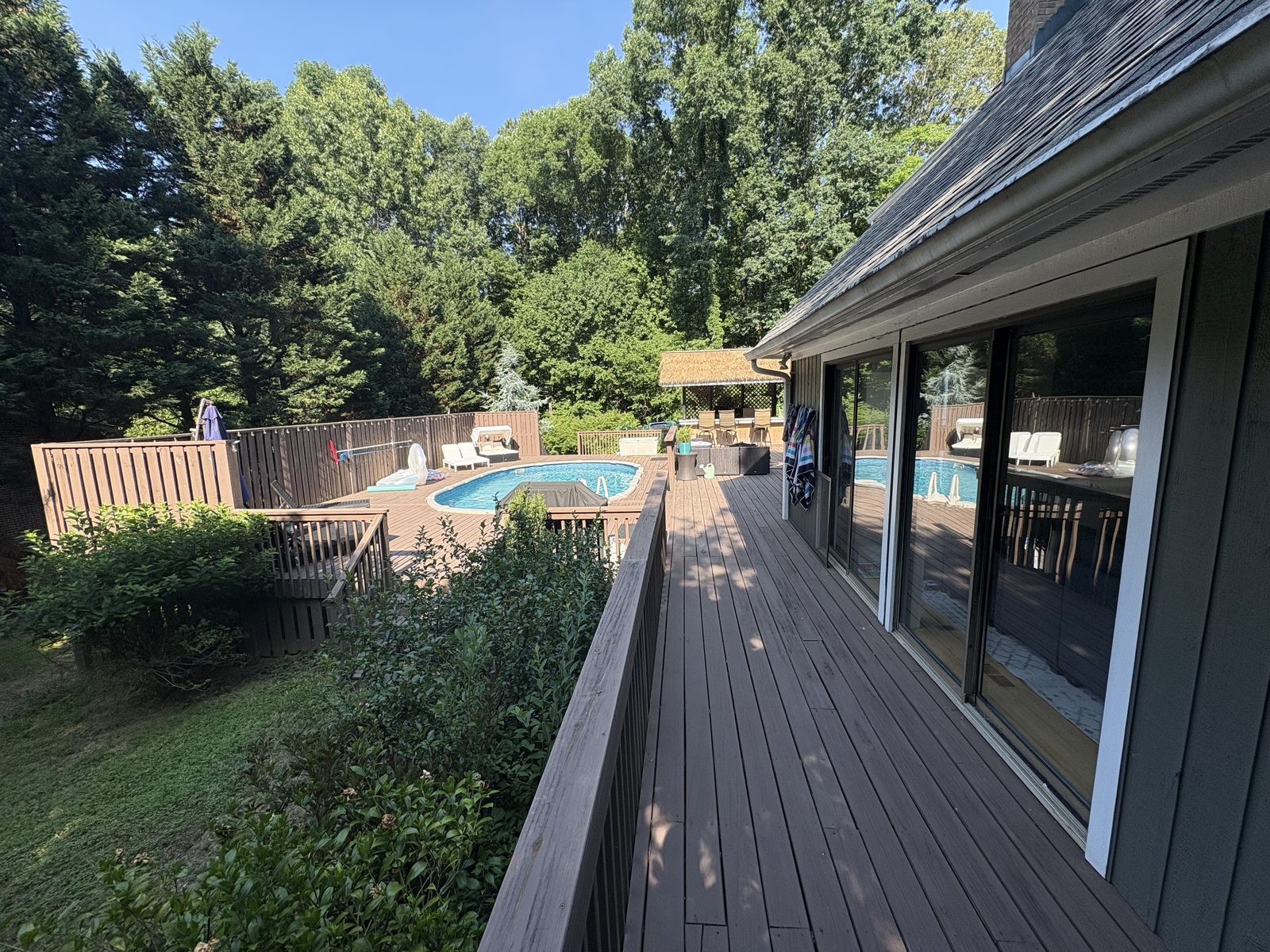 Backyard pool deck staining project in Wendell NC