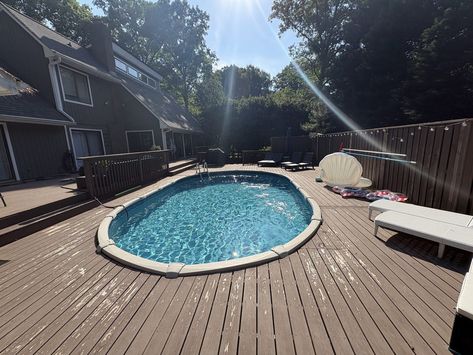Weathered pool deck before staining in Wendell NC